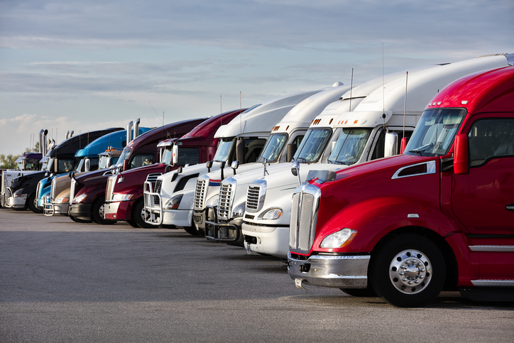 Group of parked semi trucks parked